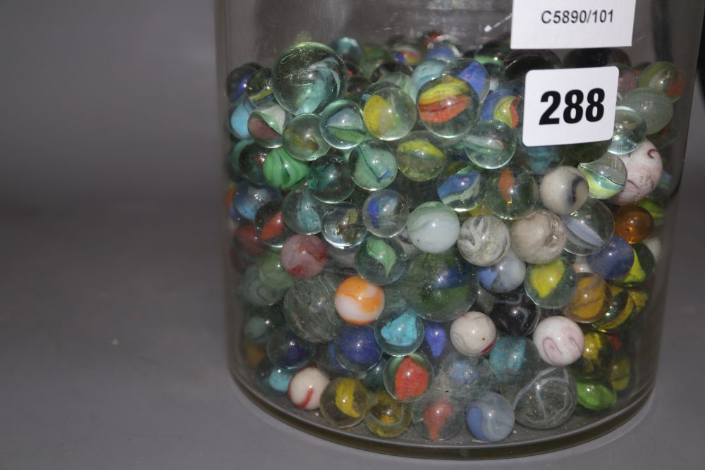 A glass jar and cover containing Victorian and later coloured marbles, height 26.5cm